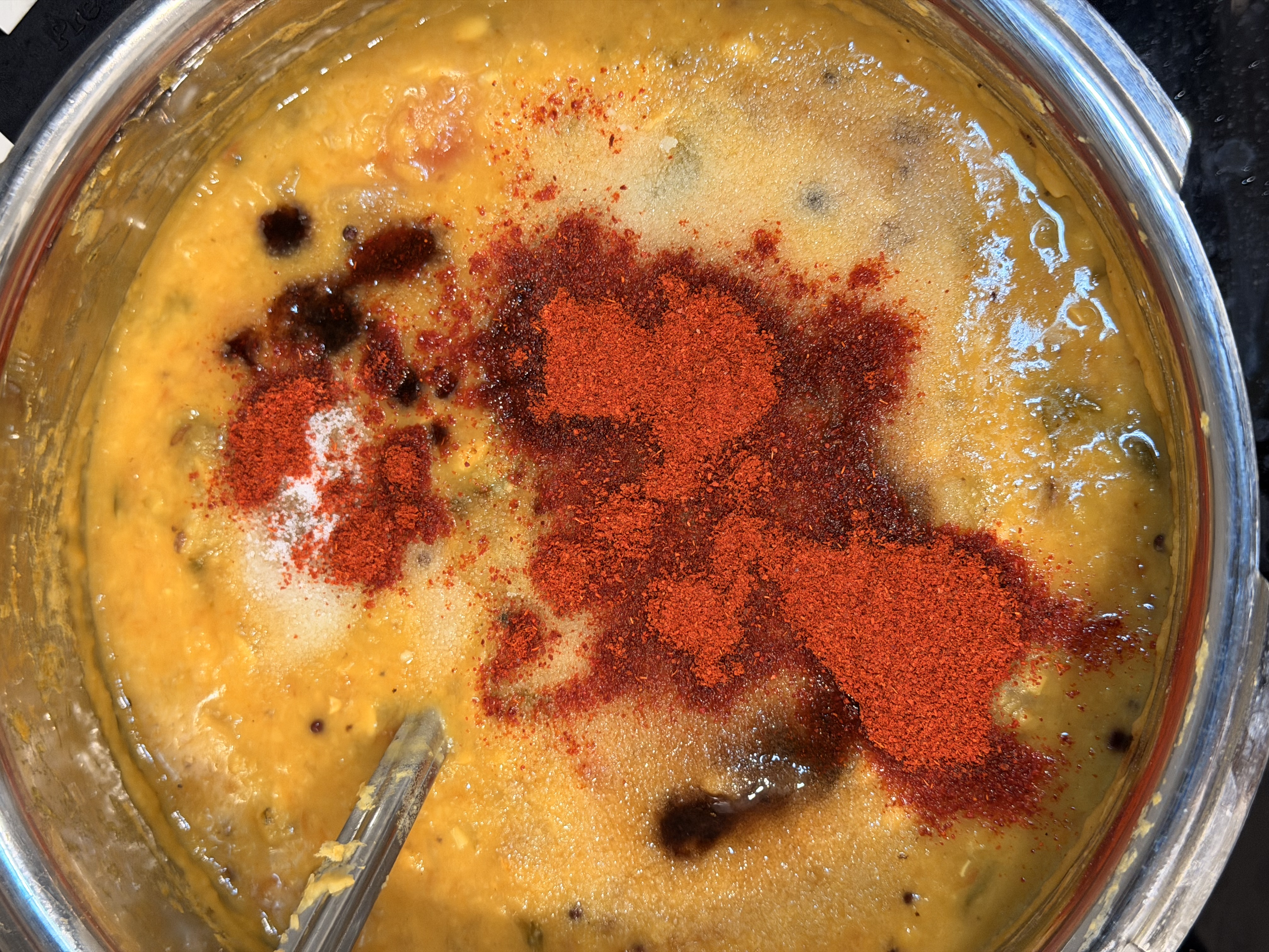 Adding red chilli powder